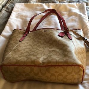 Pink trimmed signature coach purse